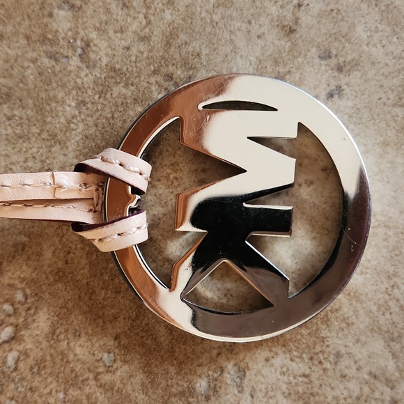 Michael Kors silver round purse charm on tan strap - Picture 5 of 7